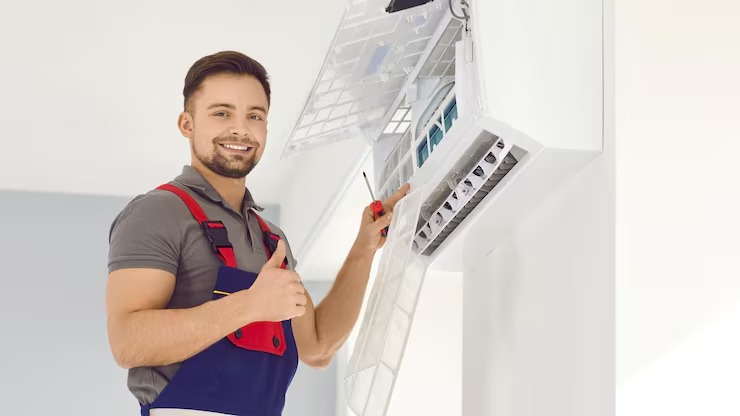 HVAC technician improving indoor air quality on a home AC system